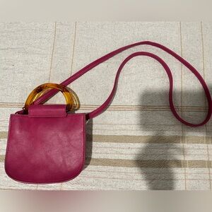 Elegant Pink Handbag with Gold Accent